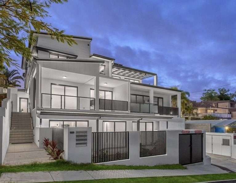 Modern home with a spacious balcony and private driveway, showcased by a home buyers agent Brisbane for premium property seekers.